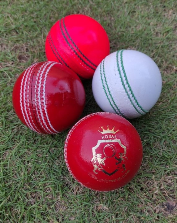 Set of 4 hand-sewn leather cricket balls in different colors, each shown from various angles including front and side views, featuring raised seams for improved grip and durability.