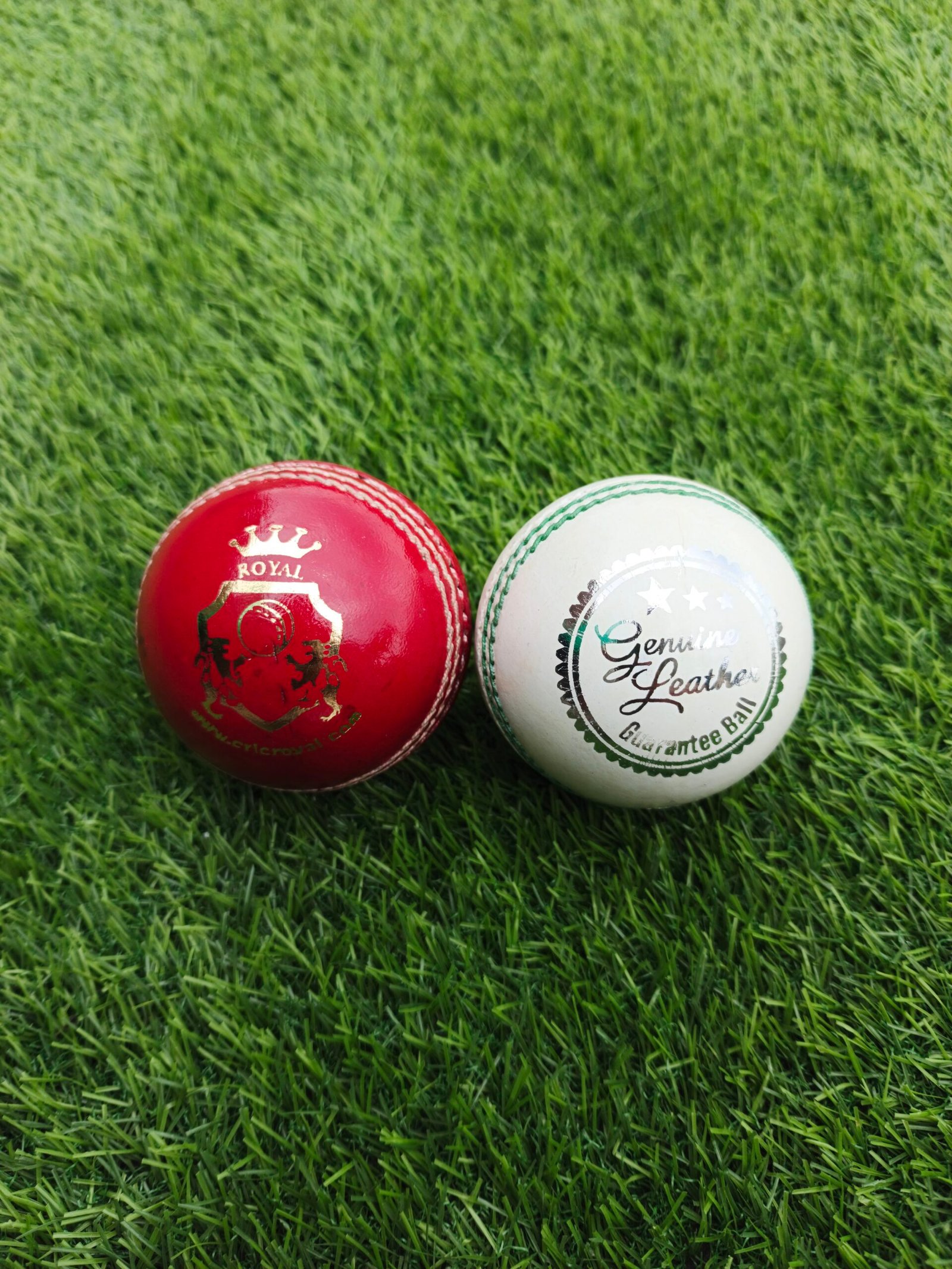 Two regulation premium leather cricket balls in red and white colors, suitable for ODI, T20 and international cricket matches