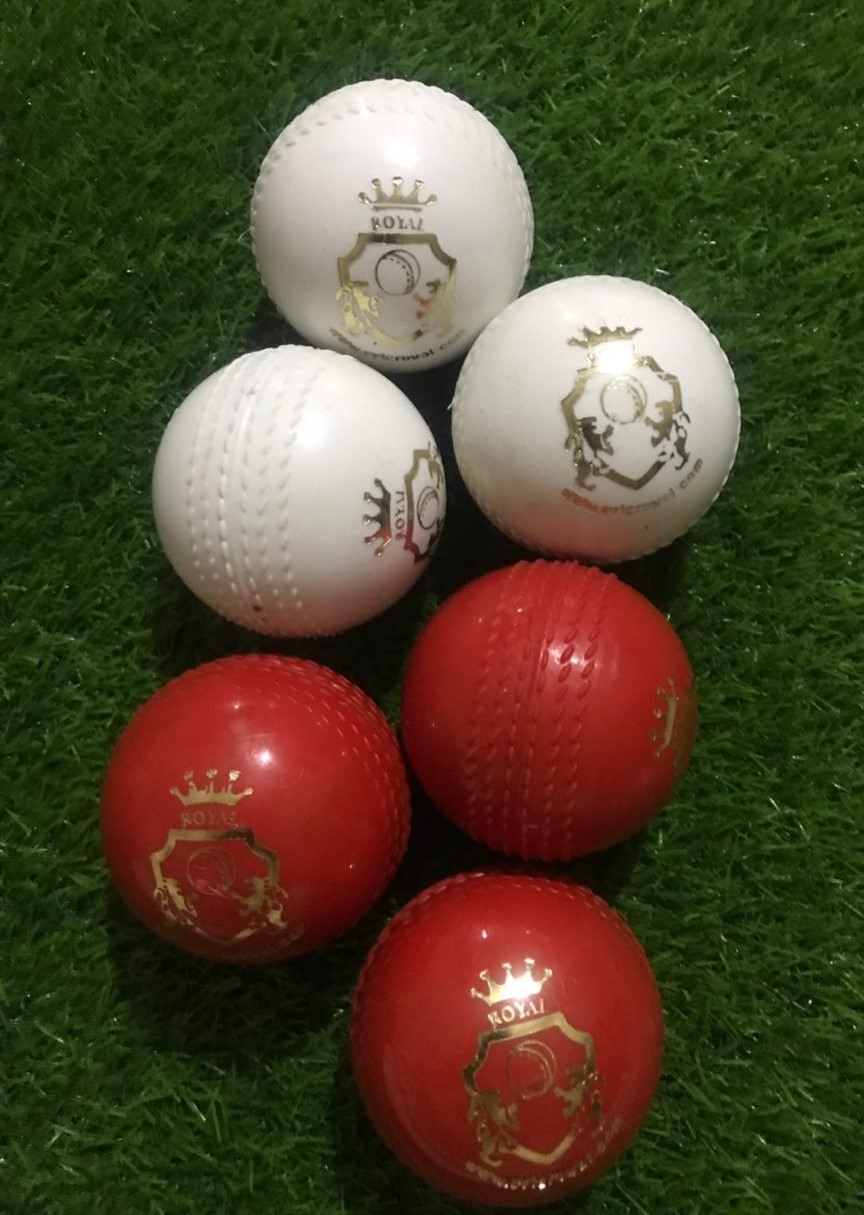 A heavy weight cricket ball with seam-style design on the side, ideal for coaching and training, arranged together for display.