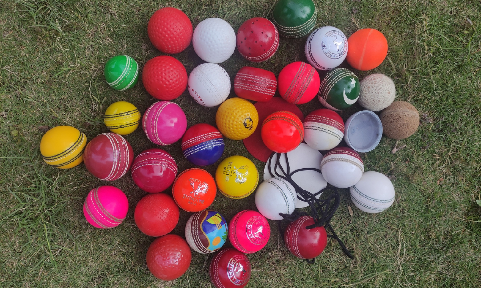 Cricket Ball 11 Coaching and training cricket balls category image with numerous balls arranged in bulk on a gross.