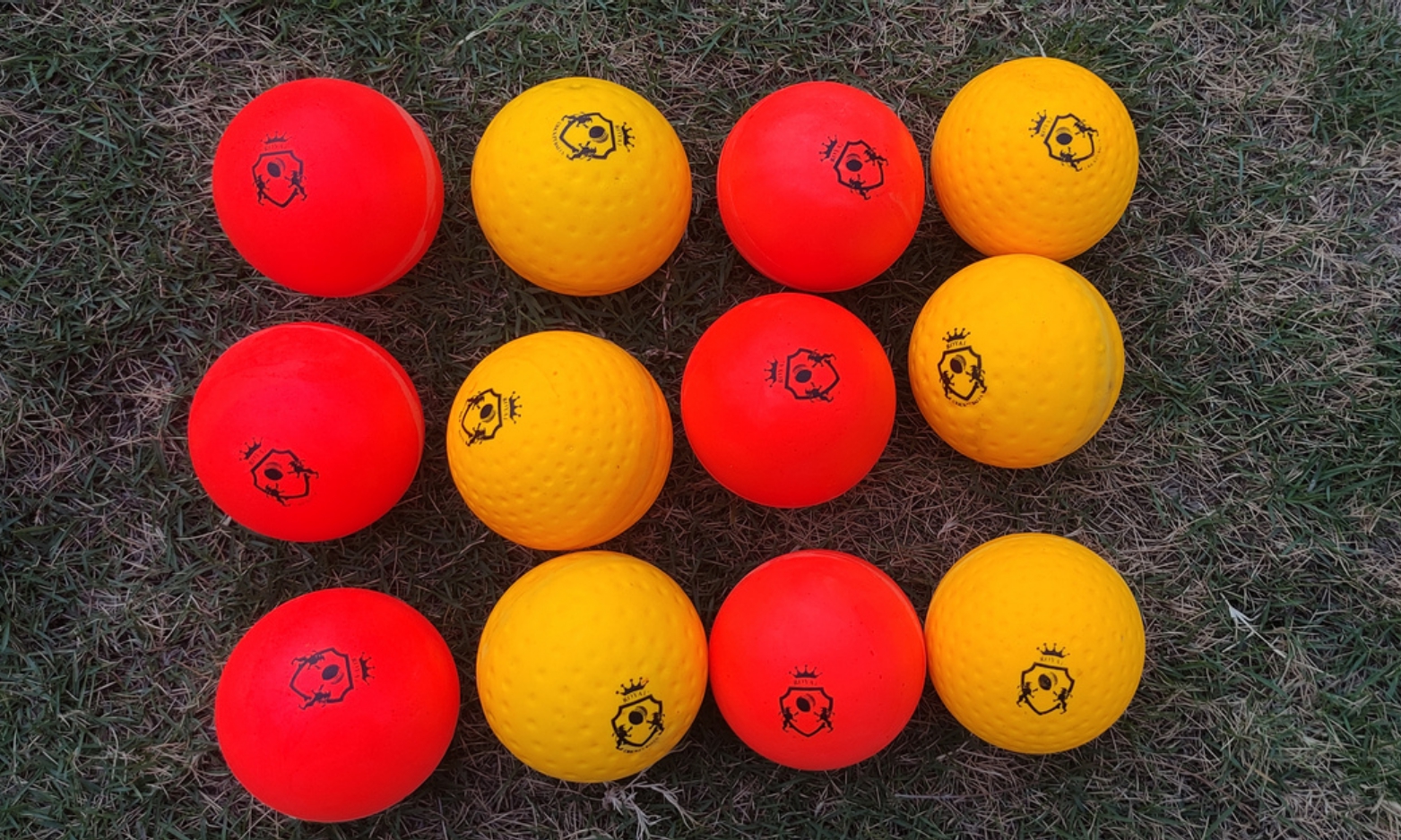 Cricket Ball 12 Feeder training balls for bowling machines shown in bulk on a gross for category display.