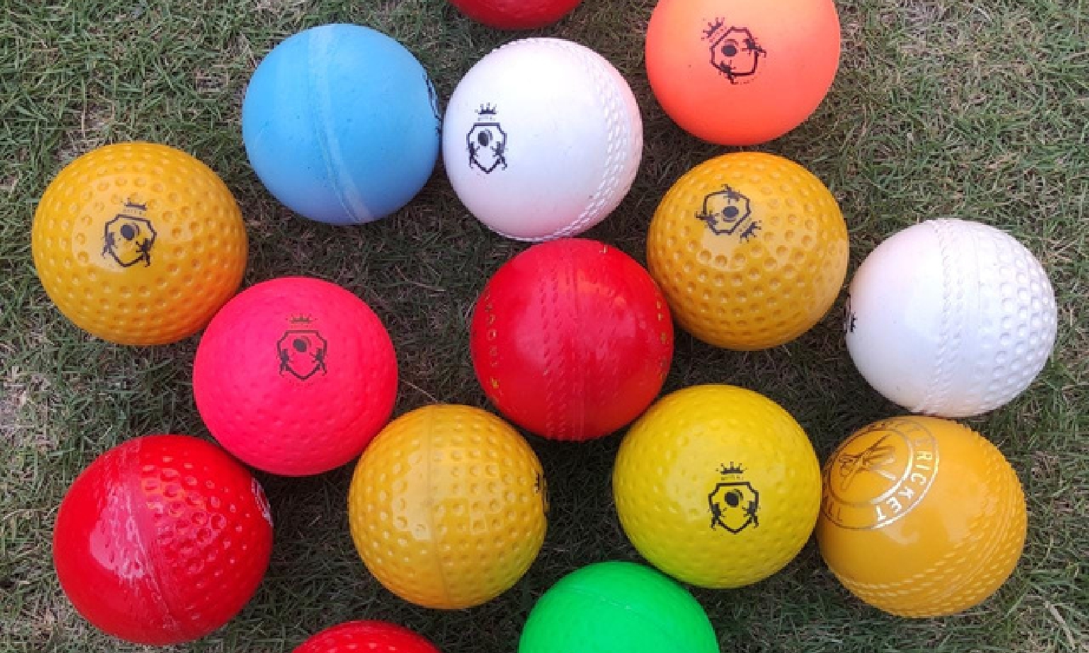 Cricket Ball 9 Synthetic practice cricket balls placed in bulk on a gross, showing multiple training balls together for the Synthetic Practice Cricket Balls category.
