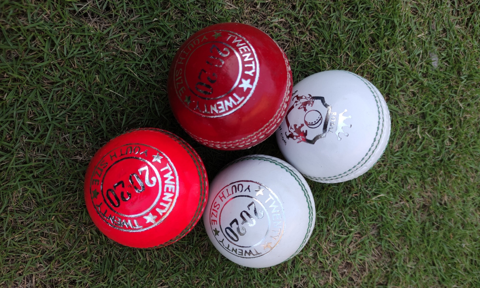 Cricket Ball 13 Women, kids and junior cricket balls category image with four different balls placed on a gross.